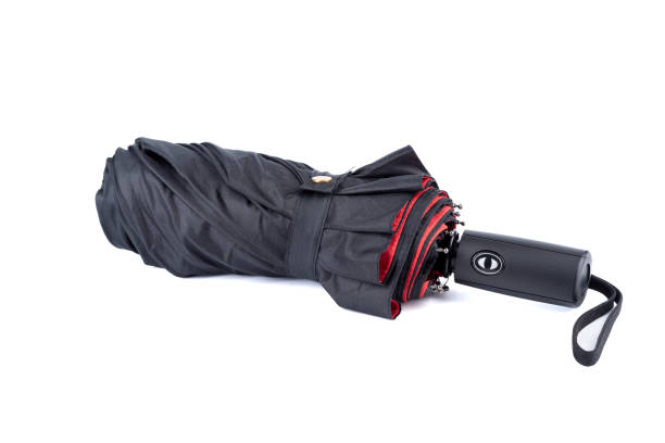 istock Folded umbrella with black top and red bottom on a white background. 1825544654