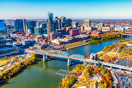 The skyline of downtown Nashville, Tennessee on the banks of the Cumberland River shot from above via helicopter at an altitude of about 800 feet.