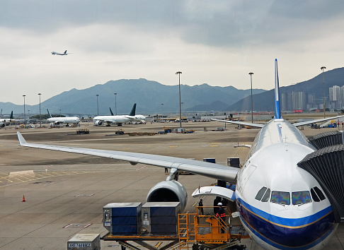 Passenger airliners parked at Hong Kong's airport waiting for passengers to board or disembark
