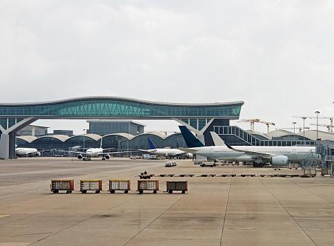Passenger airliners parked at Hong Kong's airport waiting for passengers to board or disembark