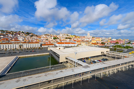 View from a cruise ship docked at the Port of Lisboa passenger terminal of the city skyline of Lisbon, Portugal. The Port of Lisbon is the third-largest port in Portugal, mainly on the north sides of the Tagus's large natural harbour that opens west, through a short strait, onto the Atlantic Ocean. Each part lies against central parts of the Portuguese capital Lisbon.