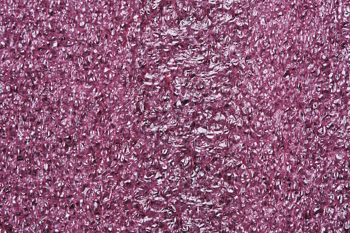 Pink abstract styrofoam background in macro photo