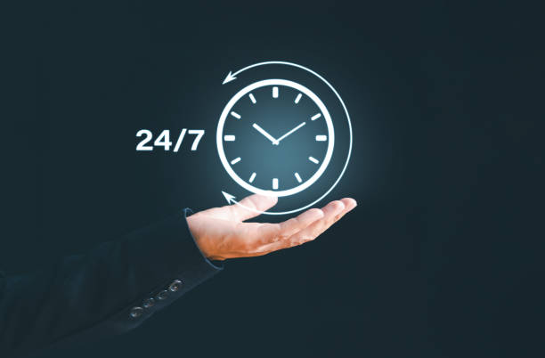 istock 24-7 hour clock on hand nonstop client service concept. Businessman show virtual worldwide nonstop support, help full-time available contact of service concept. Customer service always assistance. 1825630441