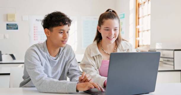 istock Learning, teamwork and high five of students on laptop in classroom, achievement and goal. Education, computer and teenager in celebration of success, happy kids and study knowledge at high school 1825633775