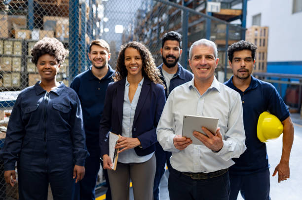 Happy group of employees at a distribution warehouse