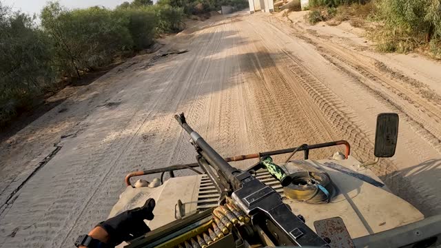 Military loading bullets in gun machine armed vehicle during Israel Hamas War 2023