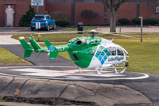 Warren, Pennsylvania, USA November 23, 2023 An Allegheny Health Network Life Flight helicopter on a helipad at the Warren General Hospital on a fall day