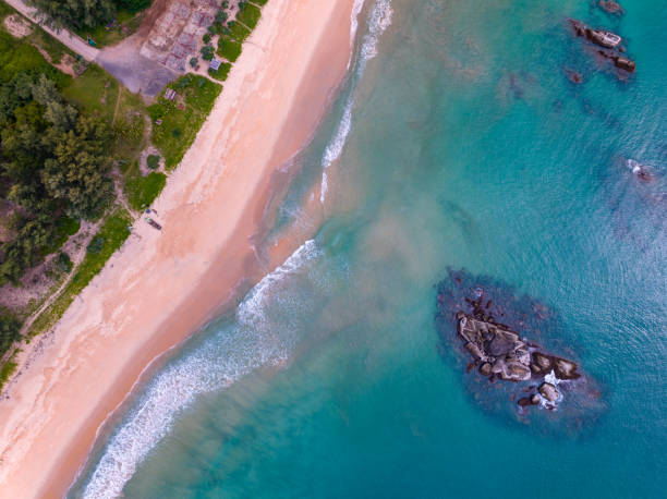 istock Bird eye view seashore with wave crashing on sandy shore. Beautiful waves sea surface in sunny day summer background, Amazing seascape top view seacoast landscape view 1825858247