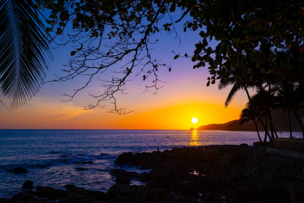 istock Beautiful colorful sunset or sunrise sky over sea with dramatic clouds nature environment background 1825859801