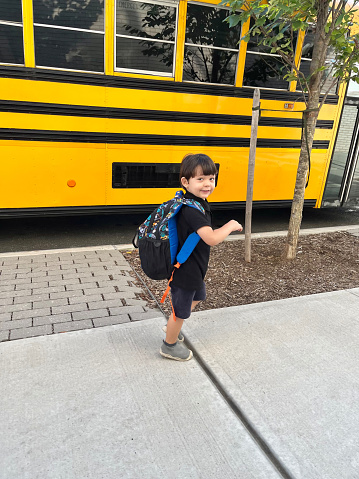 View of a boy going to school in a first day of school