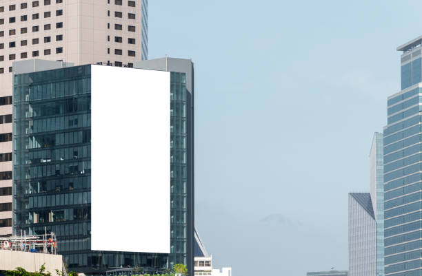 istock Mock up white large LED display vertical billboard on tower building .clipping path for mockup 1825940587