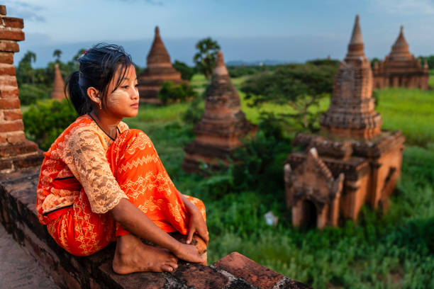 istock Young Burmese girl looking at an ancient temples in Bagan, Myanmar 1825955942