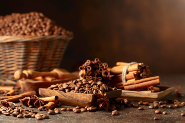 istock Coffee beans with spices on a brown vintage background. 1826043124
