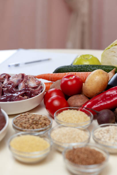 istock Meat, liver and vegetables on the table prepared for the start of work 1826060488