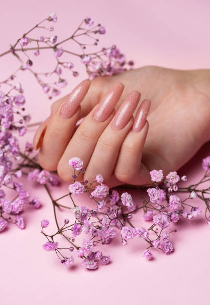 istock Female hands with beautiful manicure on pink background 1826080579