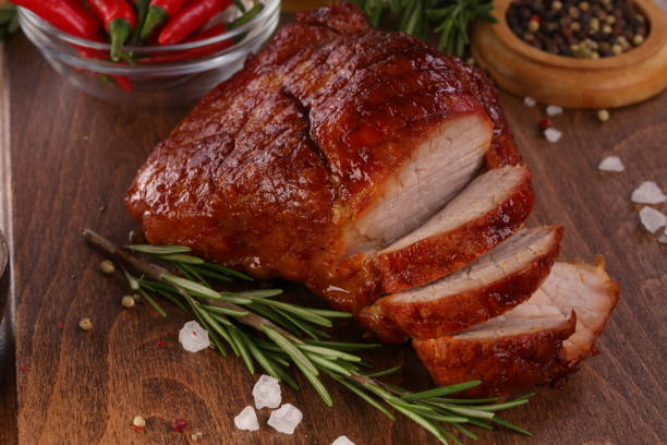 Boiled pork on a wooden background stock photo