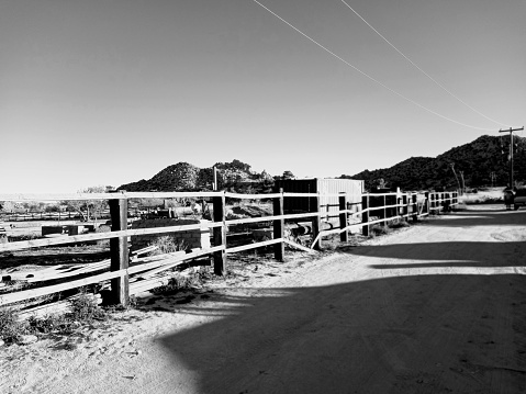 Dirt Road with Fence and Shadows