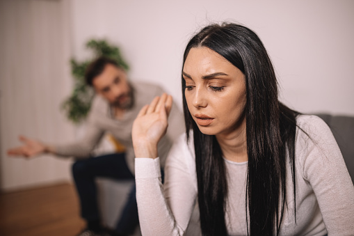 The couple is experiencing communication difficulties, with the man talking and the woman remaining silent