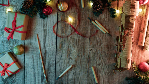 istock wooden desk with Christmas presents background 1826190387