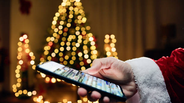 istock Santa looking for Photos on his smartphone 1826194719