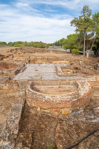 Exterior archaeological remains of the floors of different Roman rooms with the floor decorated with mosaics with geometric figures in the Mitreo house in Mérida, Spain.