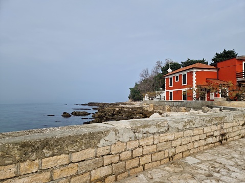 red house by the sea