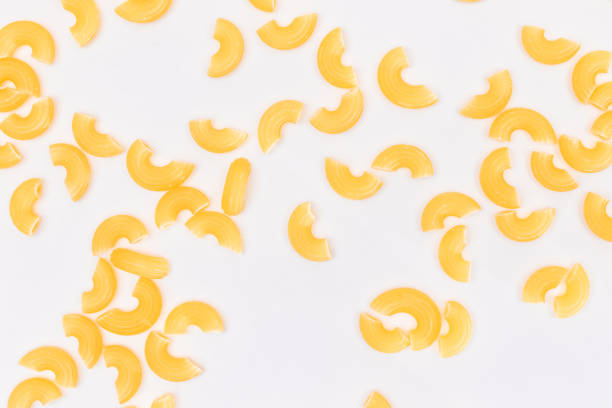 istock Scattered Uncooked Chifferi Rigati Pasta on White Background 1826288610