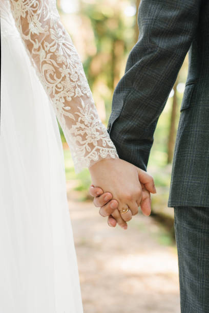 istock Wedding couple, lovers bride and groom holding hands go 1826294100