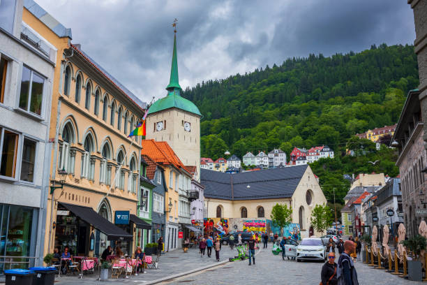 bergen cathedral in the city of bergen, norway is illumnated by a summer sunset - scandinavian church front view norway imagens e fotografias de stock