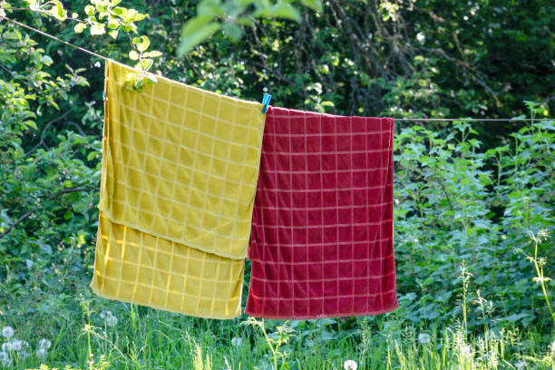 istock a red and yellow towel is hanging on a string to dry 1826341010