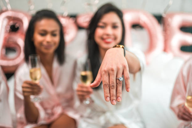 Hispanic Bride Showing Engagement Ring in Silk Robe