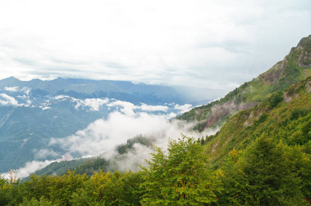istock Beautiful view from the heights of mountains with clouds. 1826360672