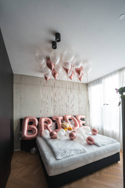 istock Bachelorette Balloon Decorations Gracefully Adorning a Hotel Bed 1826360690