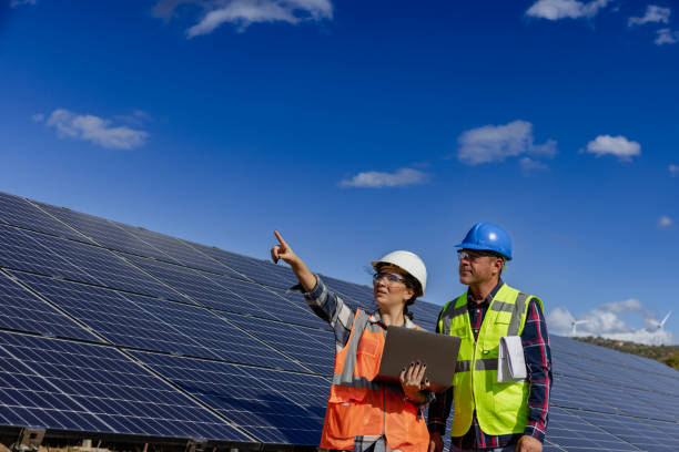 istock Solar panel and engineer workers working on a farm on clean electricity. 1826366634