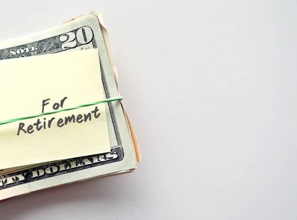 istock Dollars Money and note with text writtenon FOR RETIREMENT on background with copy space - concept of financial planning to save money for purpose of retirement 1826376273