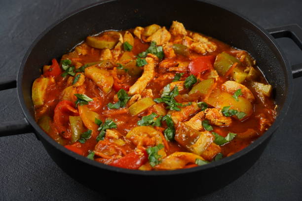 istock Chicken breast stew with vegetables and herbs and tomato sauce. 1826397230