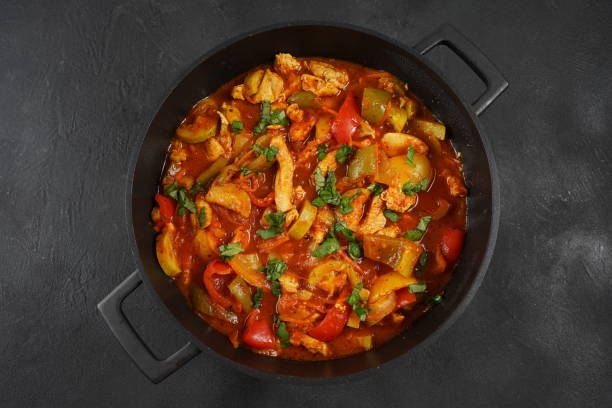 istock Chicken breast stew with vegetables and herbs and tomato sauce. 1826397656