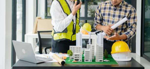 istock Engineer Teamwork Meeting, Drawing working on blueprint meeting for project working with partner on model building at office. Asian industry professional team 1826409343