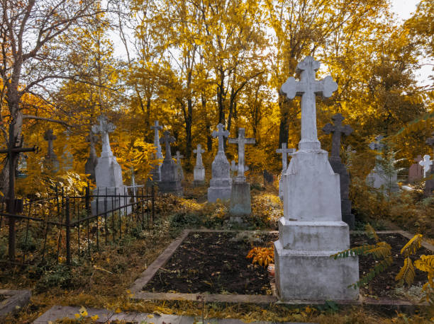istock Autumn cemetery. Abandoned stone crosses. 1826427984