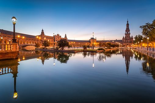 Plaza de Espana water canal reflections very early in the morning, Seville, Spain