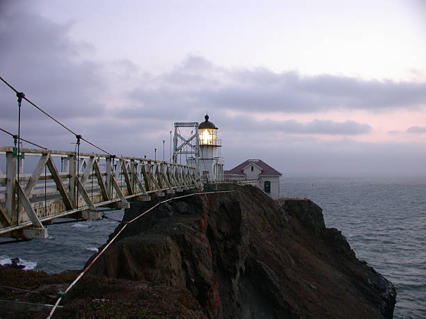 bridge to lighthouse stock photo