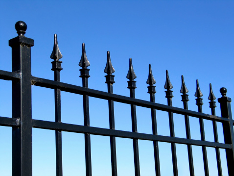 An ornamental iron fence.