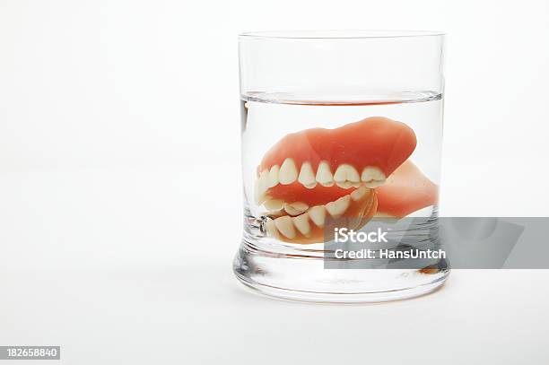 Dentures In A Glass Of Water Stock Photo - Download Image Now - Dentures, Drinking Glass, Glass - Material