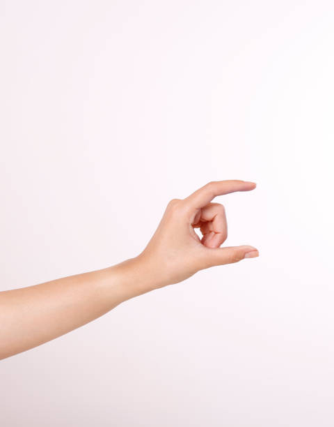 istock Close up hand holding something like a bottle or can isolated 1826592361