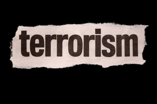 newspaper cutting of the word 'terrorism' against black