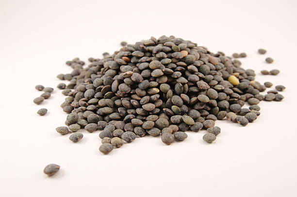 istock Heap of continental (green) lentils on white background 182659480