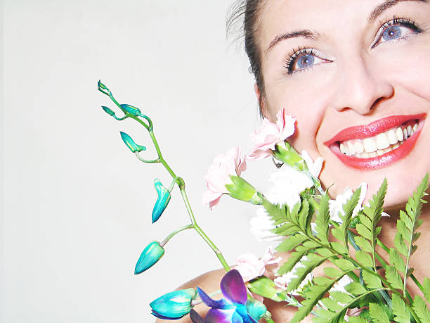 istock Smiling woman holding a bouquet 182659826