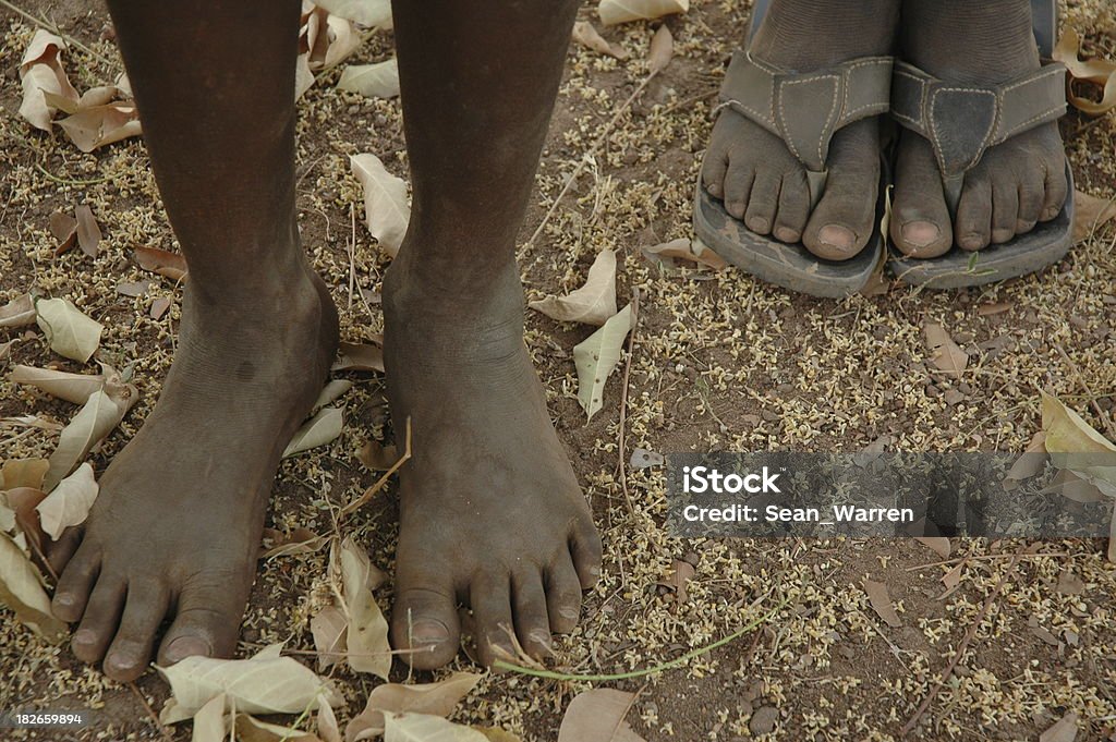 Village Feet "These are the feet of two children in Ivory Coast, West Africa." Africa Stock Photo