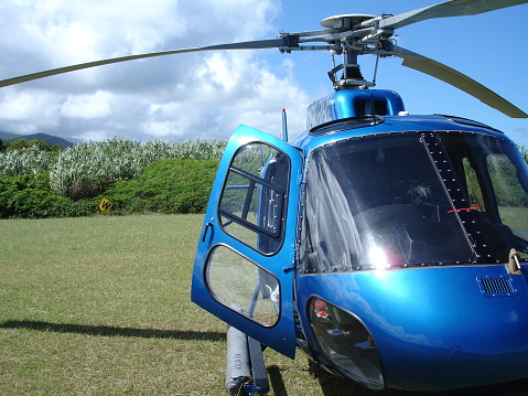 Blue Hawaiian Helicopters  Blue helicopter on Maui coast near Hana