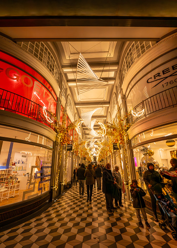 London, UK - Nov 20 2023: Quadrant Arcade, a chic retail complex with upscale shops adjoining Regent Street in central London. Seen with illuminations and Christmas decorations.
